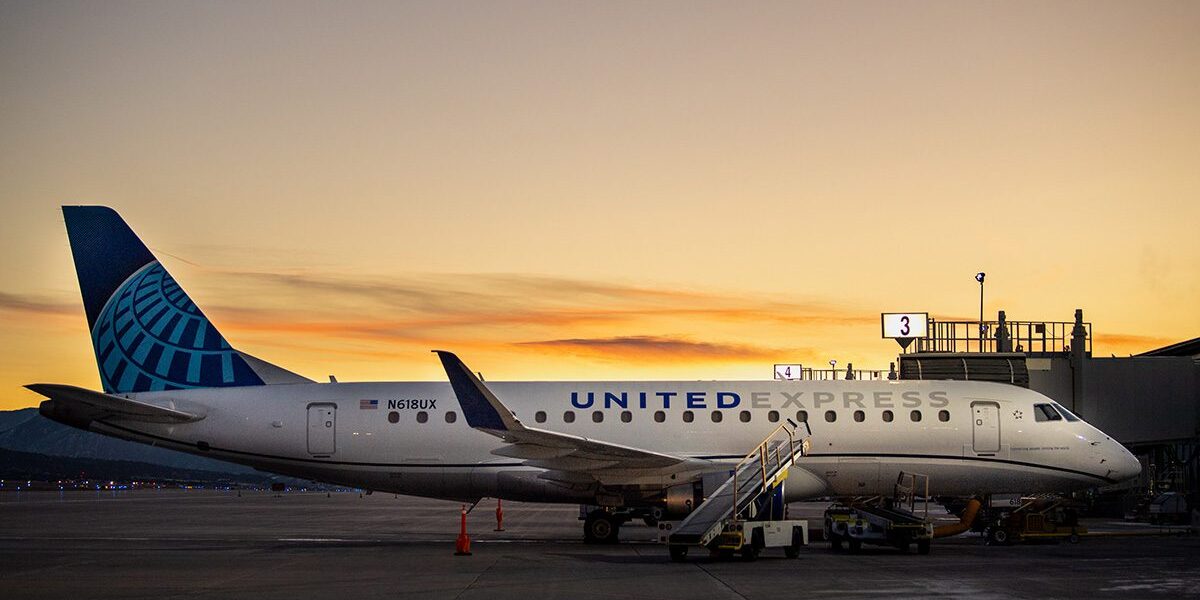 Plane at gate at sunset