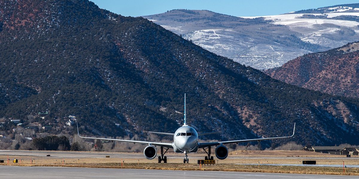 Plane on runway in mountains